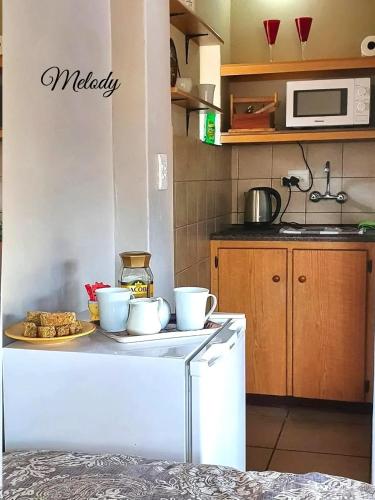 Kuchyň nebo kuchyňský kout v ubytování Harmony and Melody self catering