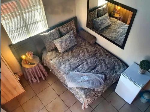 Postel nebo postele na pokoji v ubytování Harmony and Melody self catering