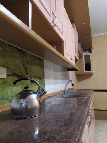 a tea kettle on a counter in a kitchen at Apartments of 4 S.K.D in Sumy