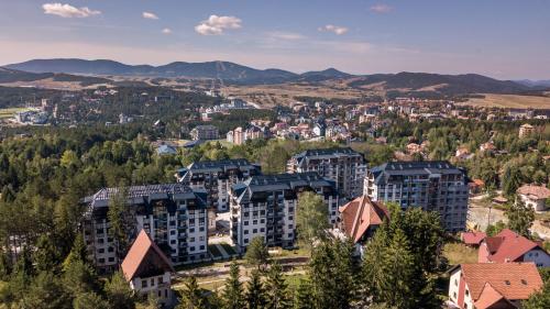 an aerial view of a city with buildings at Titova Vila Zlatibor in Zlatibor