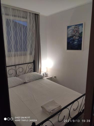Postel nebo postele na pokoji v ubytování Apartmani Sollei