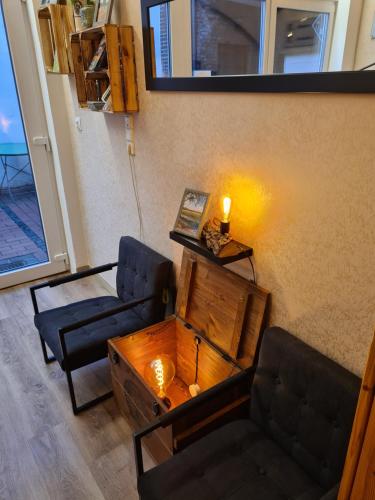 a living room with a couch and a table at Franziskaner am Markt in Löningen