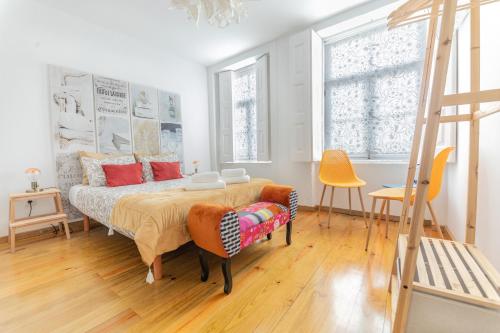 a bedroom with a bed and a ladder at Douro View House Ribeira in Porto