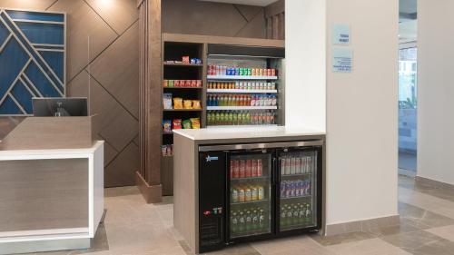 a store with a drink cooler in a room at Holiday Inn Express & Suites - Tijuana Otay by IHG in Tijuana