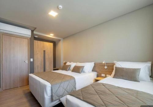 Postel nebo postele na pokoji v ubytování Laghetto Resort Golden Gramado