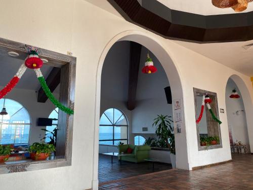 a lobby with christmas decorations on the walls at Tropical apartment in Cancún