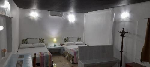 Ein Bett oder Betten in einem Zimmer der Unterkunft Casa del Jaibo