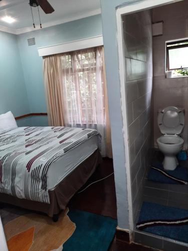 Ένα ή περισσότερα κρεβάτια σε δωμάτιο στο Luvuyos Guest House Pmb