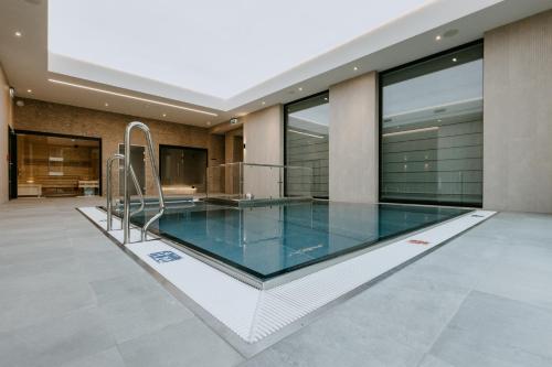 a swimming pool in the middle of a house at VISLOW Resort in Wisła