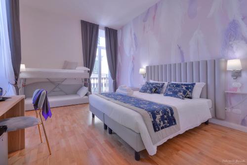 Postel nebo postele na pokoji v ubytování Hotel Cosmos