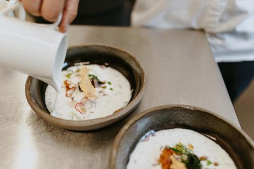 two bowls of food sitting on a table at VISLOW Resort in Wisła
