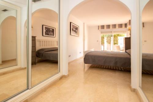 A bed or beds in a room at Ground Floor Apartment, Los Jardines de Santa Maria Elviria
