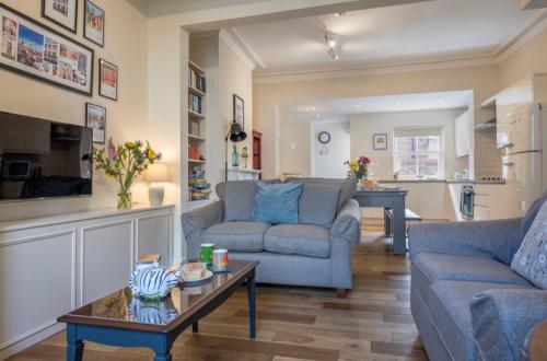 a living room with two couches and a coffee table at 109 Nunnery Lane - a House of York holiday home in York