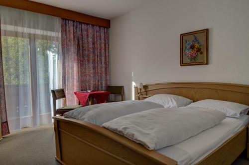 Postel nebo postele na pokoji v ubytování Garni Kofler