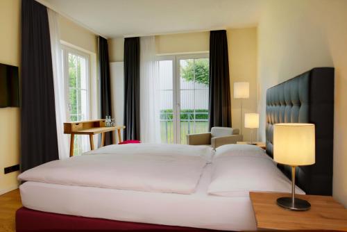 Ένα ή περισσότερα κρεβάτια σε δωμάτιο στο Hotel Zielonka