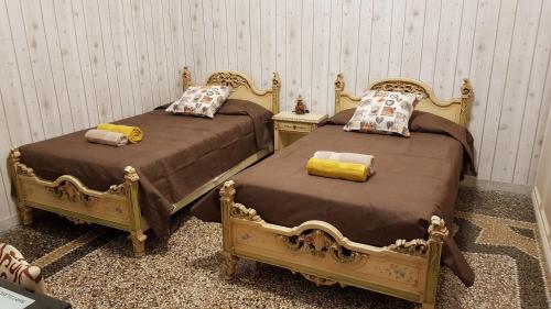 Ліжко або ліжка в номері La casa di Bonnie & Clyde
