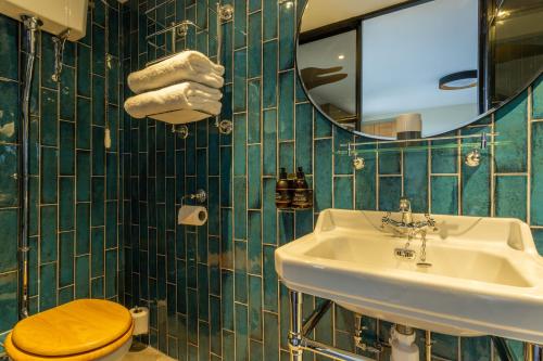 Et badeværelse på Riva Boutique Hotel