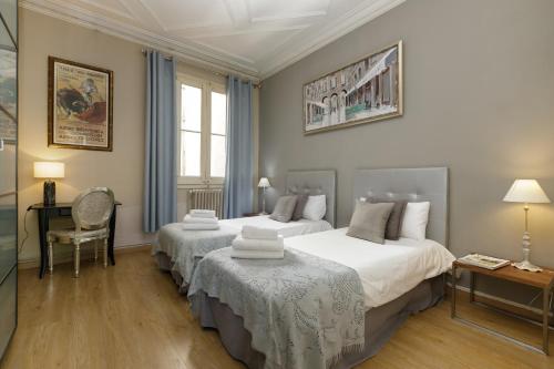 Postel nebo postele na pokoji v ubytování Enjoy Apartments Gran Via