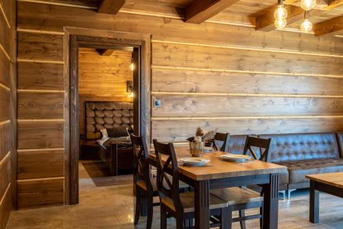a dining room with a table and chairs at TatrApart in Zakopane