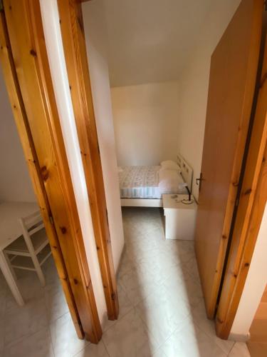 Ein Bett oder Betten in einem Zimmer der Unterkunft L’Oasi Saracena