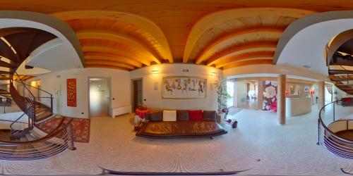 a living room with a couch in the middle of a building at Relais Villa Annamaria Bed end Breakfast in Istrana