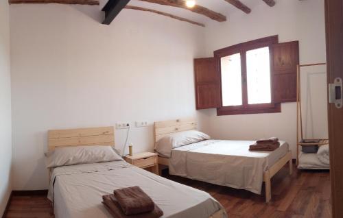En eller flere senge i et værelse på Apartamentos Rurales Rad Icarium