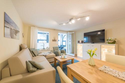 TV a/nebo společenská místnost v ubytování Haus am Meer Wintergarten PH 7, 2 SZ, strandnah by Unsere Urlaubszeit
