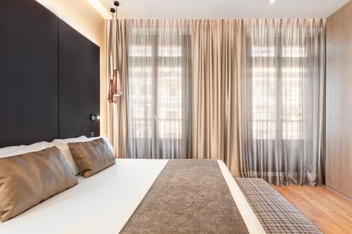 Letto o letti in una camera di Catalonia Gran Vía Madrid