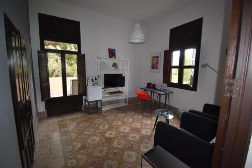 a living room with a couch and a table at Villa Nestor in Ingenio