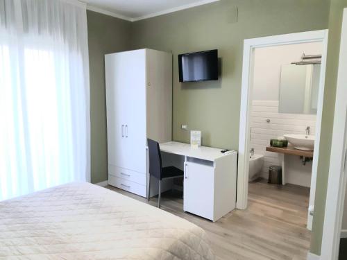 Ένα ή περισσότερα κρεβάτια σε δωμάτιο στο B&B Villa Emanuel
