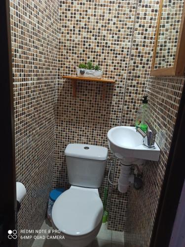 a small bathroom with a toilet and a sink at My Love in Arenas de San Pedro