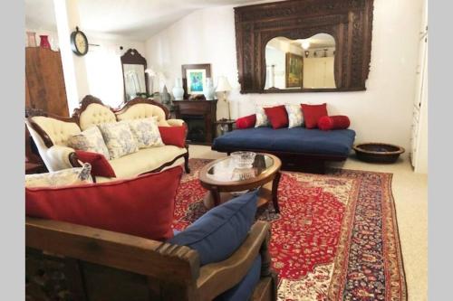 a living room with two couches and a rug at Elegant Spacious Private Studio ~ Upscale Berkeley in Berkeley