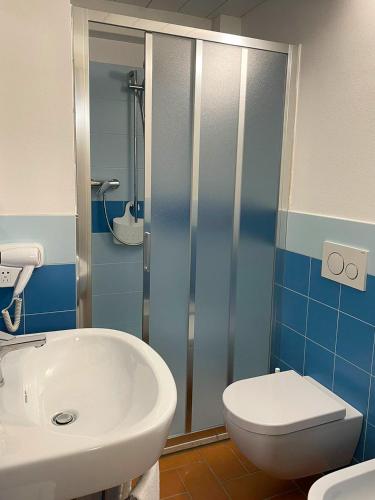 a bathroom with a white sink and a toilet at Dimora Toscana in Treggiaia