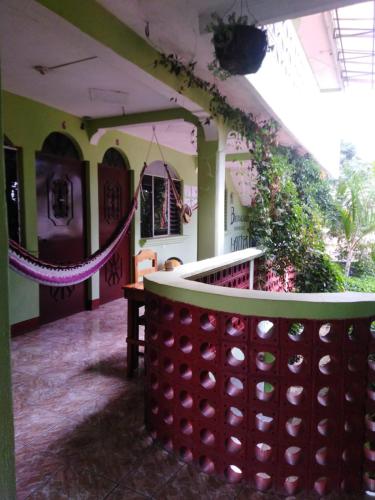 a room with a table and a rope in a building at Hospedaje Lolita in San Pedro La Laguna