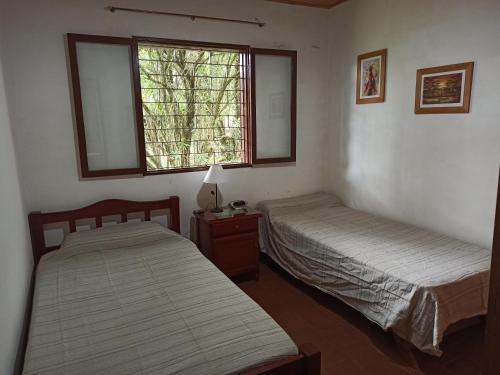 A bed or beds in a room at Casa Raco