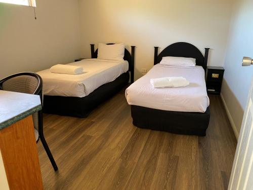 Emerald Explorers Innにあるベッド