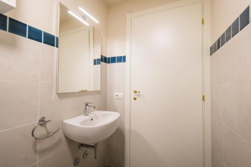 a bathroom with a sink and a mirror at Hortensia Garden in Macerata