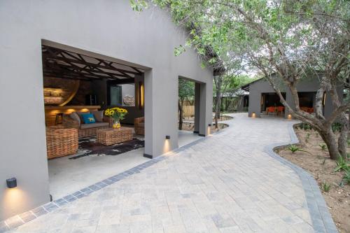 an outdoor walkway leading to a villa at Little Africa Safari Lodge in Hoedspruit