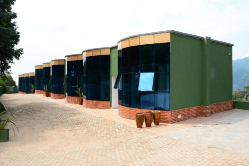 a row of buildings are lined up on a street at Chimpanzee Lodge in Rwumba