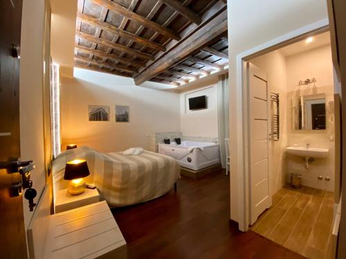 Кровать или кровати в номере Campo Marzio Hotelier