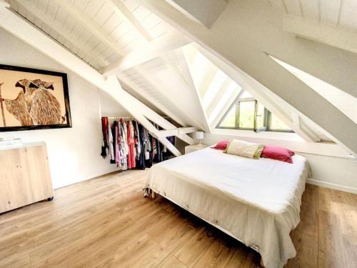 a bedroom with a bed in a attic at Acacia Secret, 3 min walk from Anse Marcel beach, on the Marina in Anse Marcel 