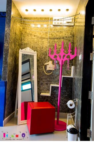 a room with a mirror and a pink object at Is Am O Chiang Mai Resort in San Sai