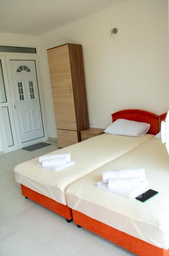 Ένα ή περισσότερα κρεβάτια σε δωμάτιο στο Bay Leaf Apartments