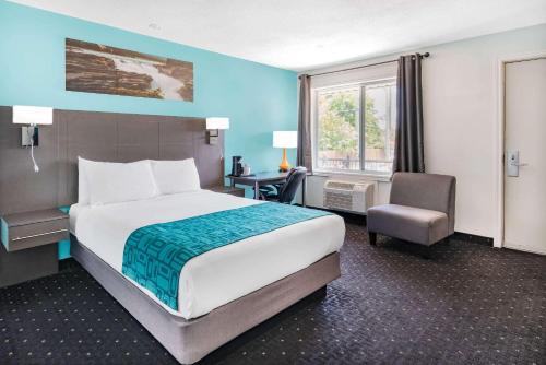Ένα ή περισσότερα κρεβάτια σε δωμάτιο στο Howard Johnson by Wyndham Gananoque
