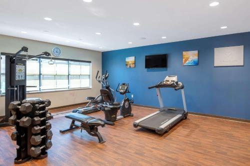 a gym with several exercise equipment in a room at Comfort Suites St George - University Area in St. George
