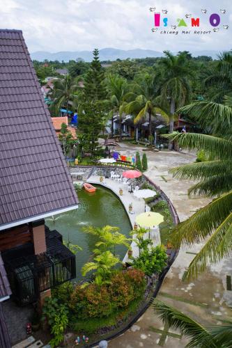 an aerial view of a resort with a bridge at Is Am O Chiang Mai Resort in San Sai