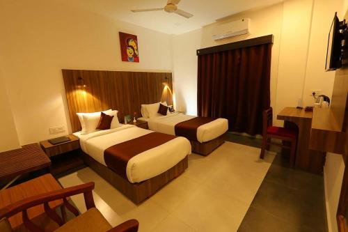 HOTEL LA SERENE Mattannurにあるベッド