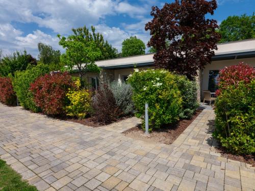 a house with a brick driveway at Parc Hotel Germano Suites & Apartments in Bardolino