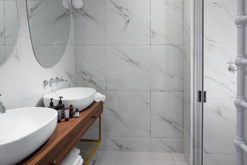 a bathroom with a sink and a shower at OREA Place Seno in Prague