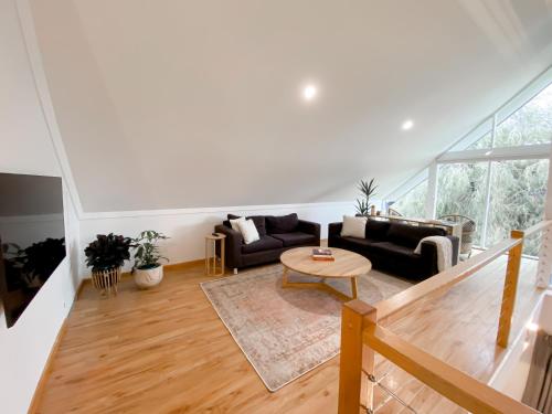 a living room with a couch and a table at Whitesands in Dunsborough